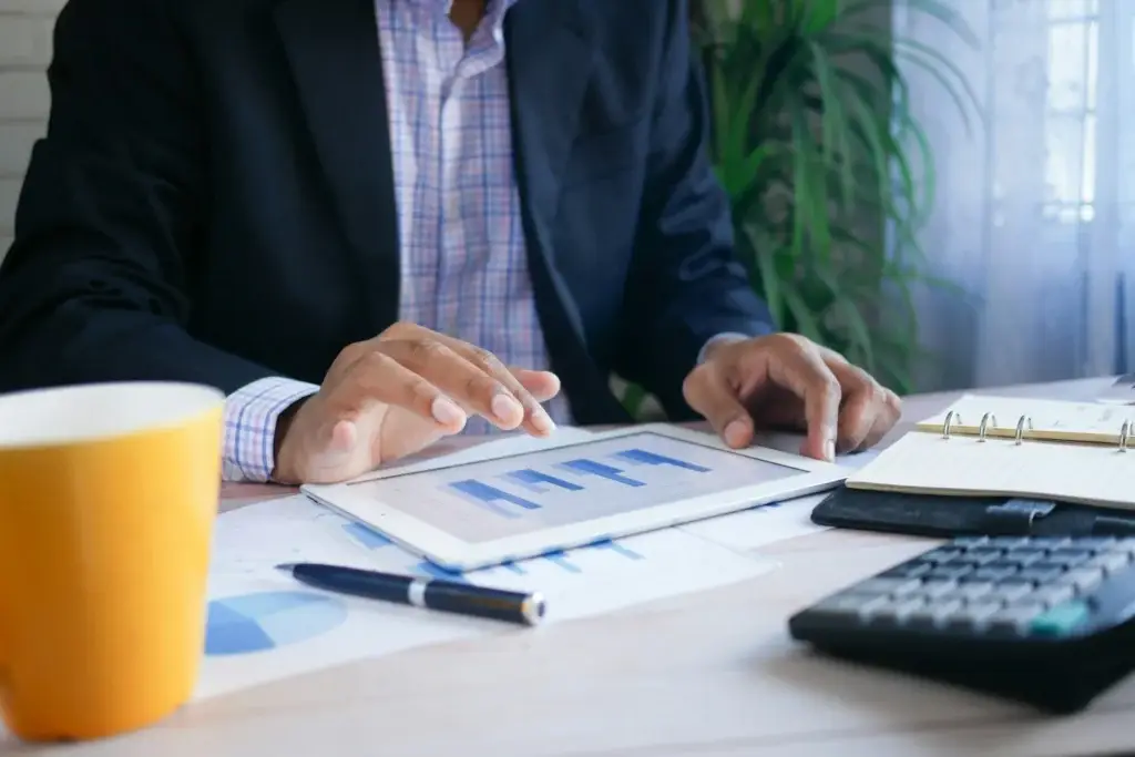 Professional analyzing workforce reports and data